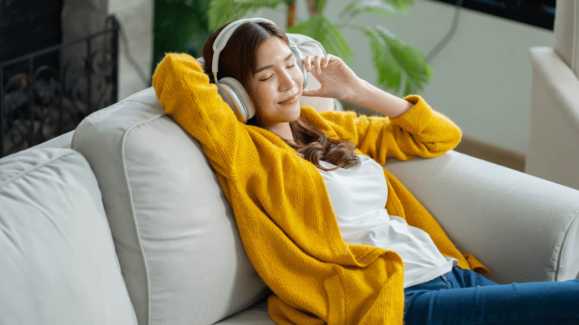intelligent woman listening to music spending time alone