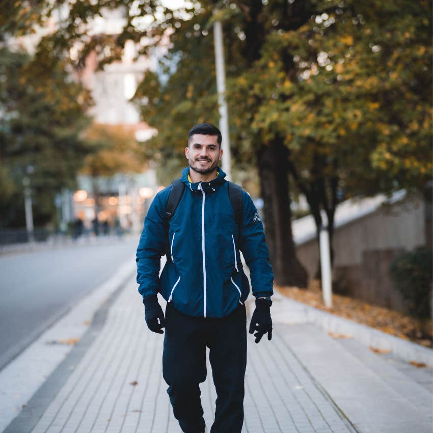 Confident man walking alone with self-assurance despite being rejected rejection