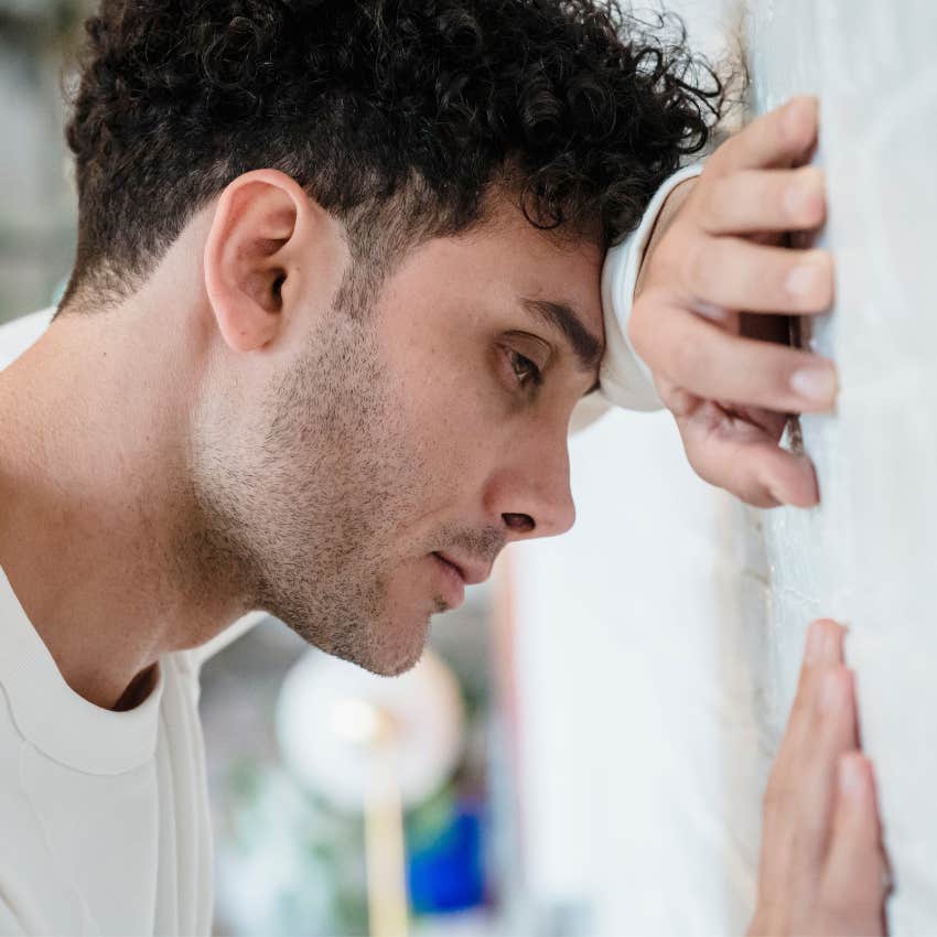 Man trying not to show his true emotions while stressed