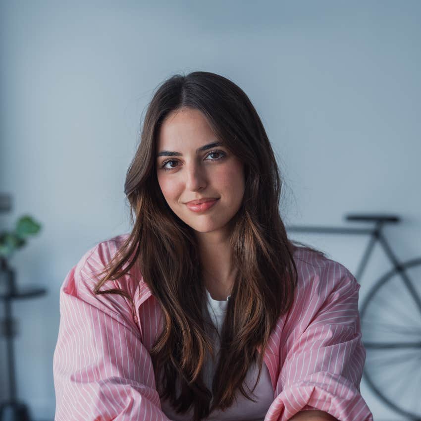 young millennial woman smiling thinking about being a good person