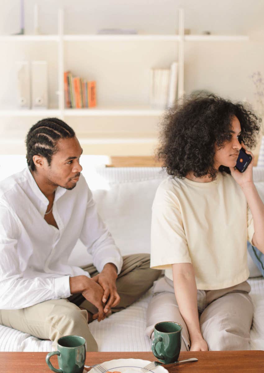 nosy man not giving woman privacy while on a call