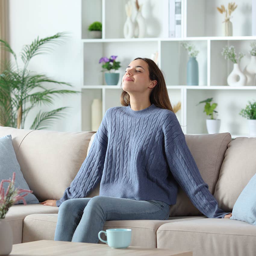 woman taking a deep breath 