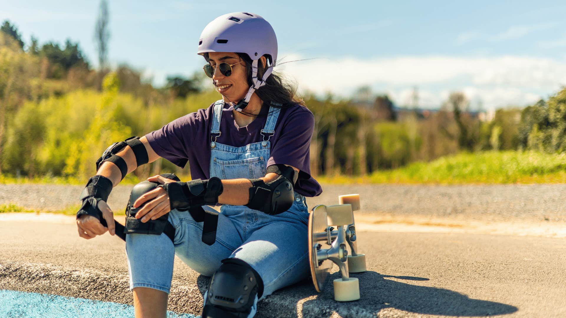 woman in helmet skateboarding 