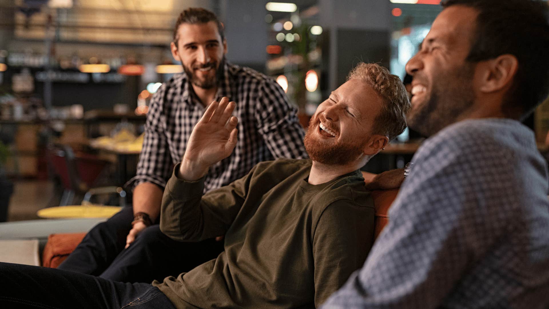 friends laughing at social club 