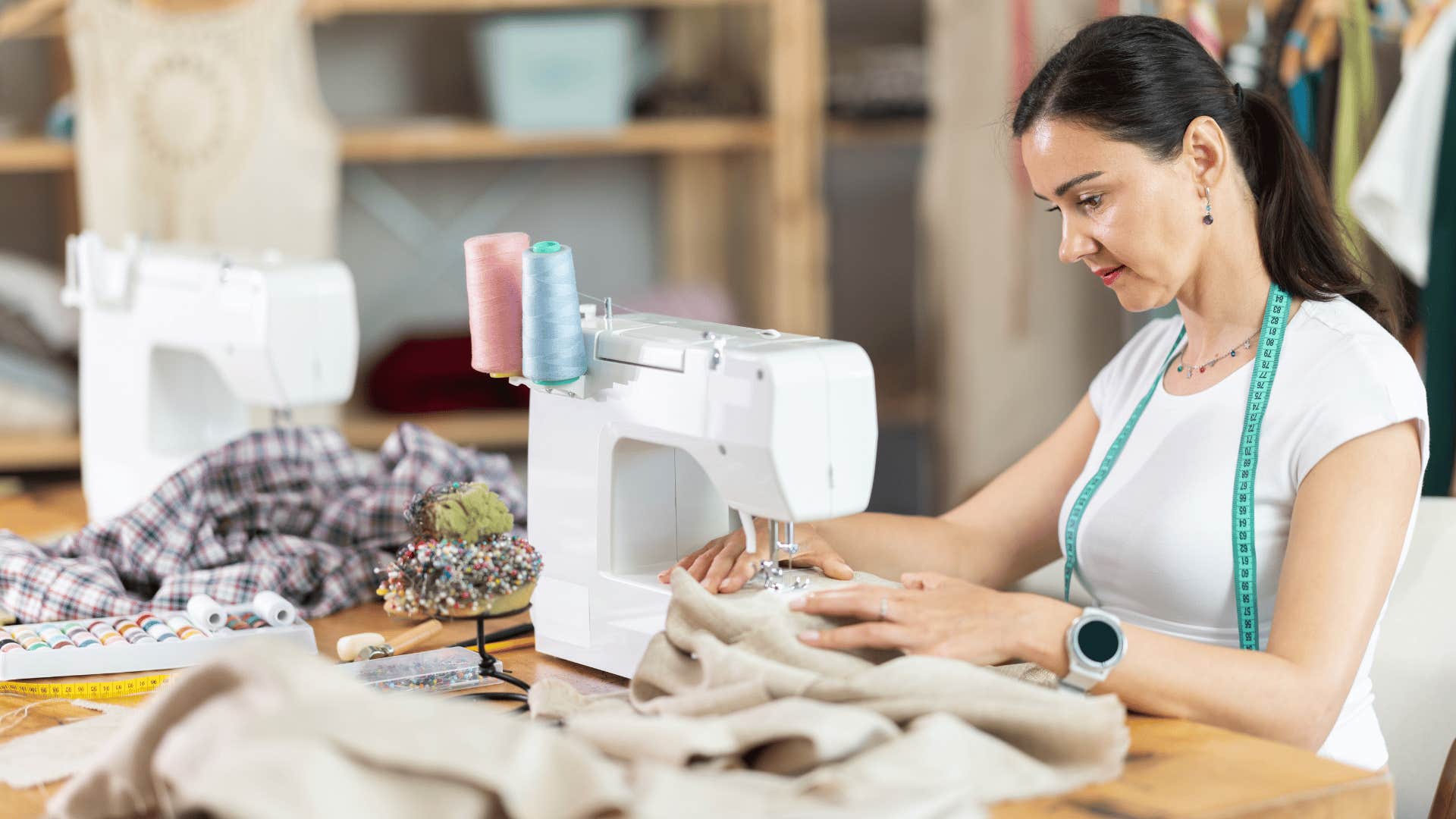 woman sewing clothing at home