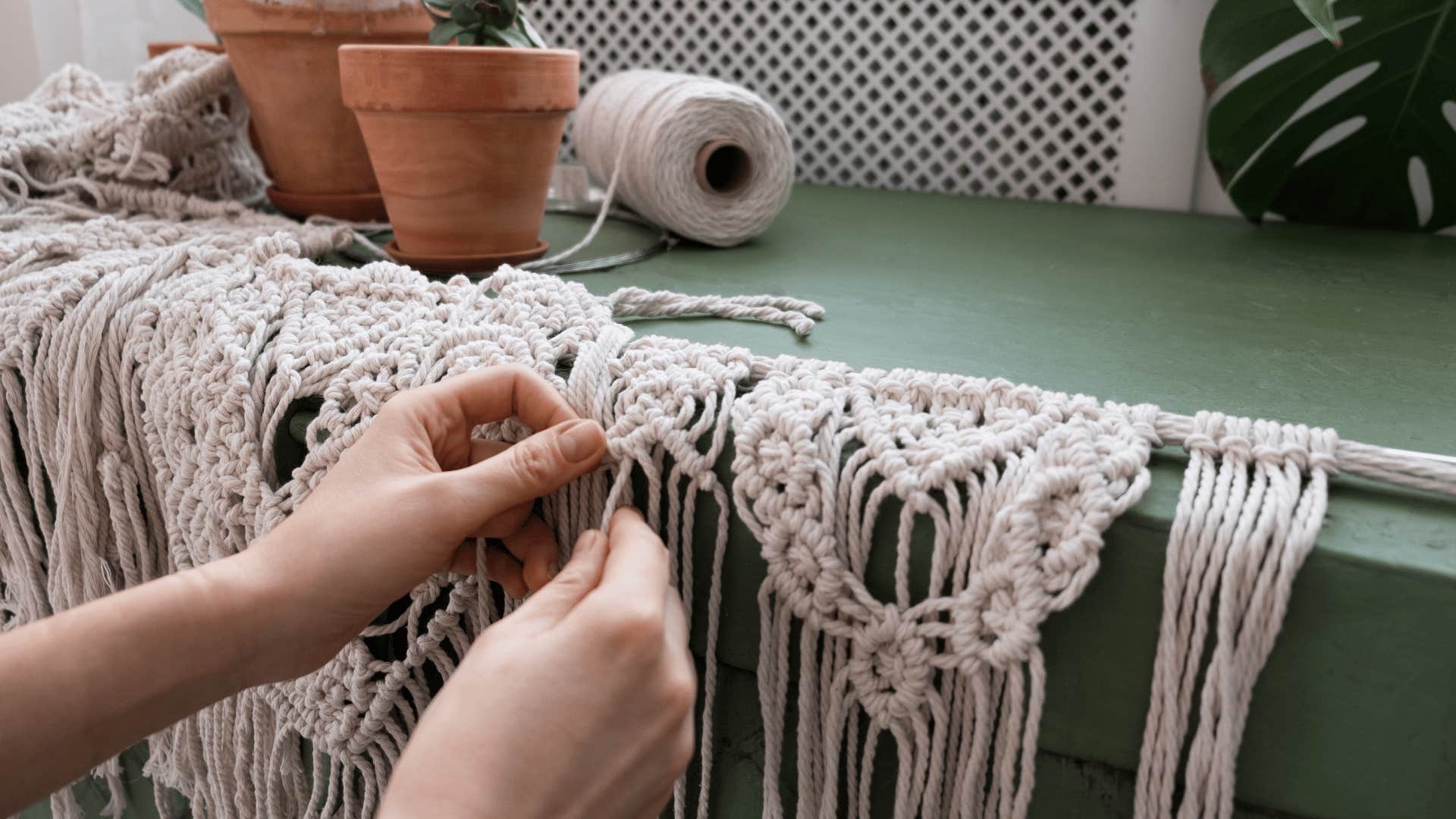 woman doing macrame at home