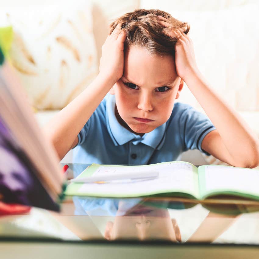 Little boy who has to do his own homework