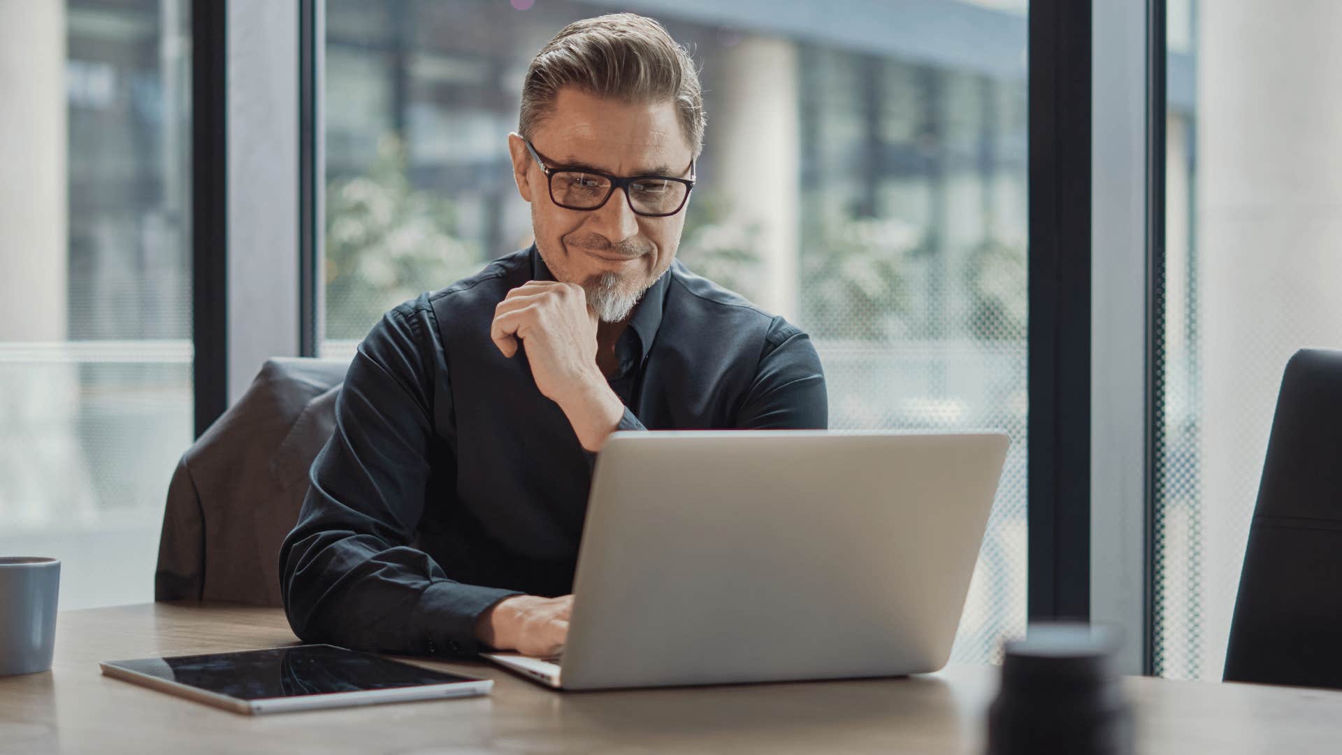 man in the office with a strong work ethic