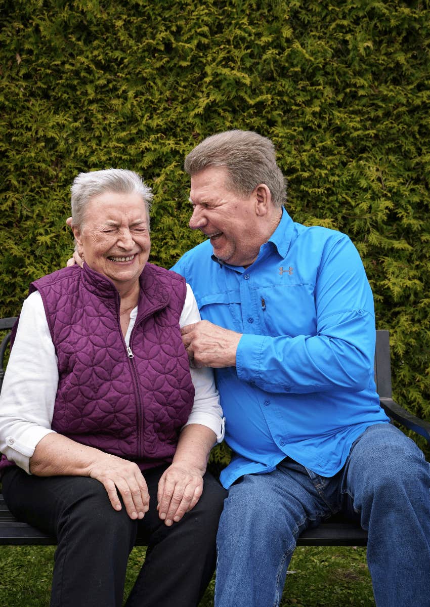 older couple laughing at their inside joke