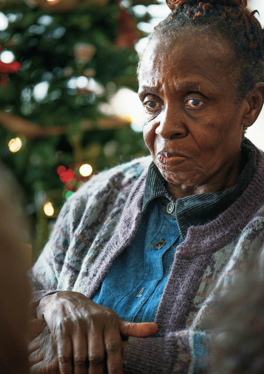 older woman wearing a serious expression