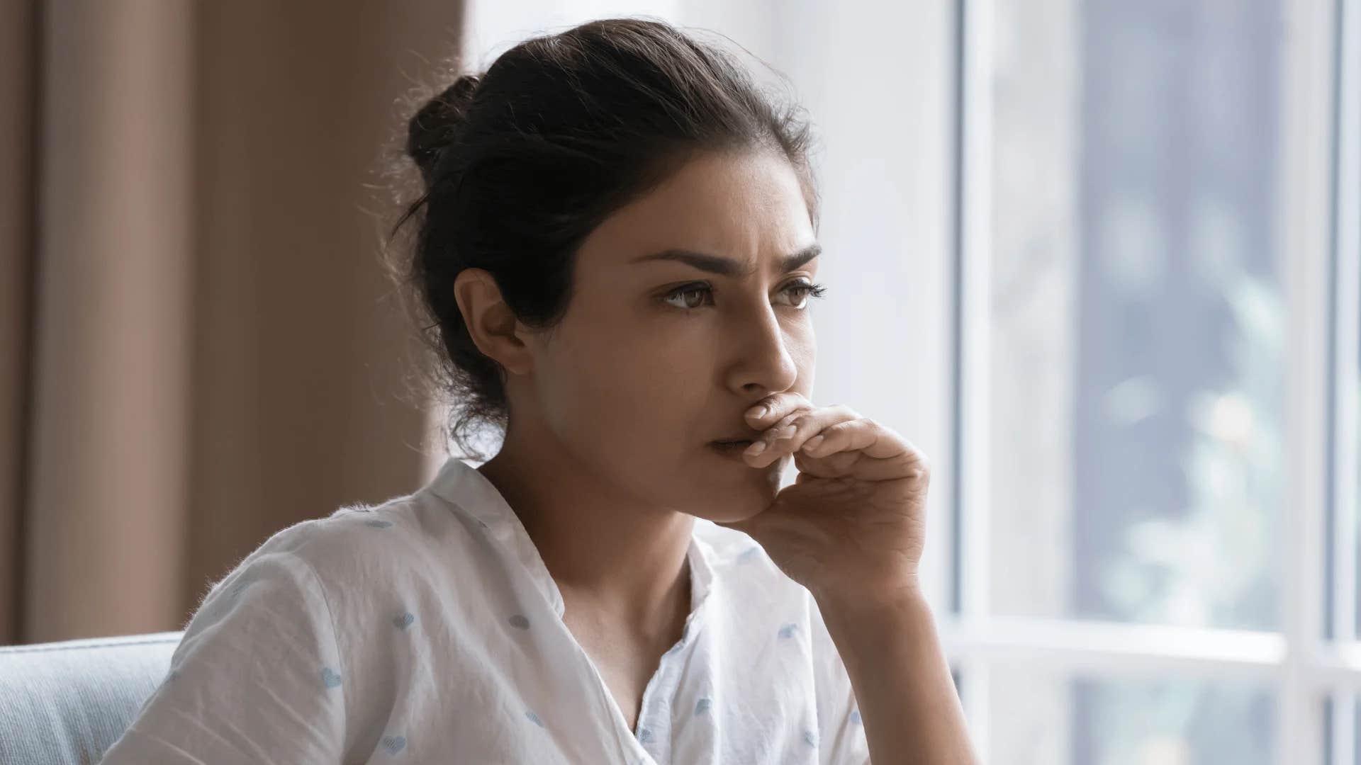 woman who passive-aggressively avoids social events because she secretly hates her job