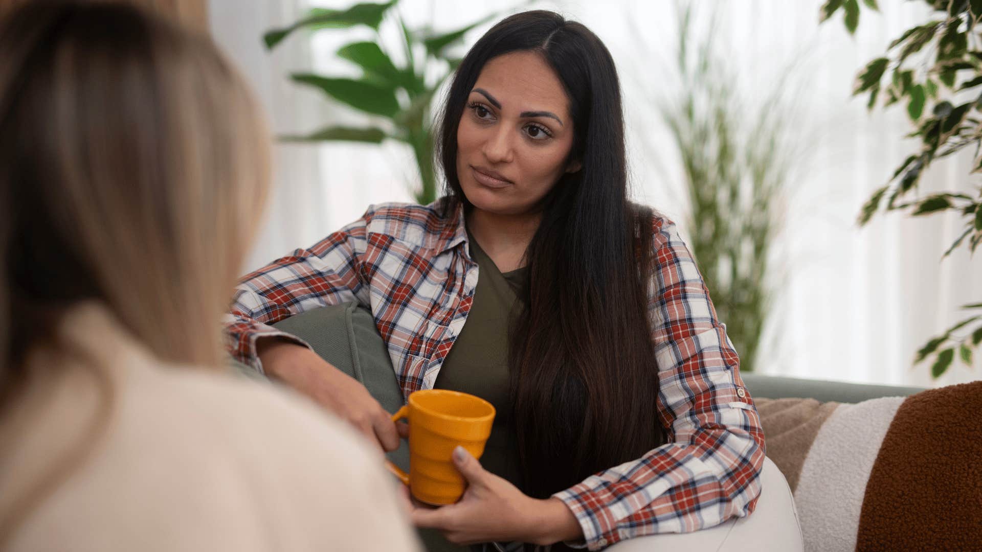 woman with bad character lying about random things in conversation with friend