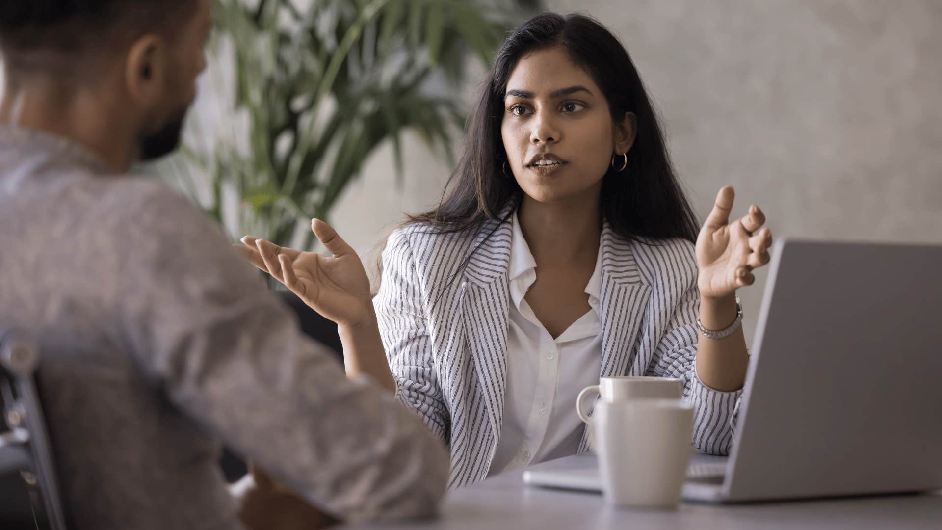 classy intelligent woman telling coworker she might be wrong but