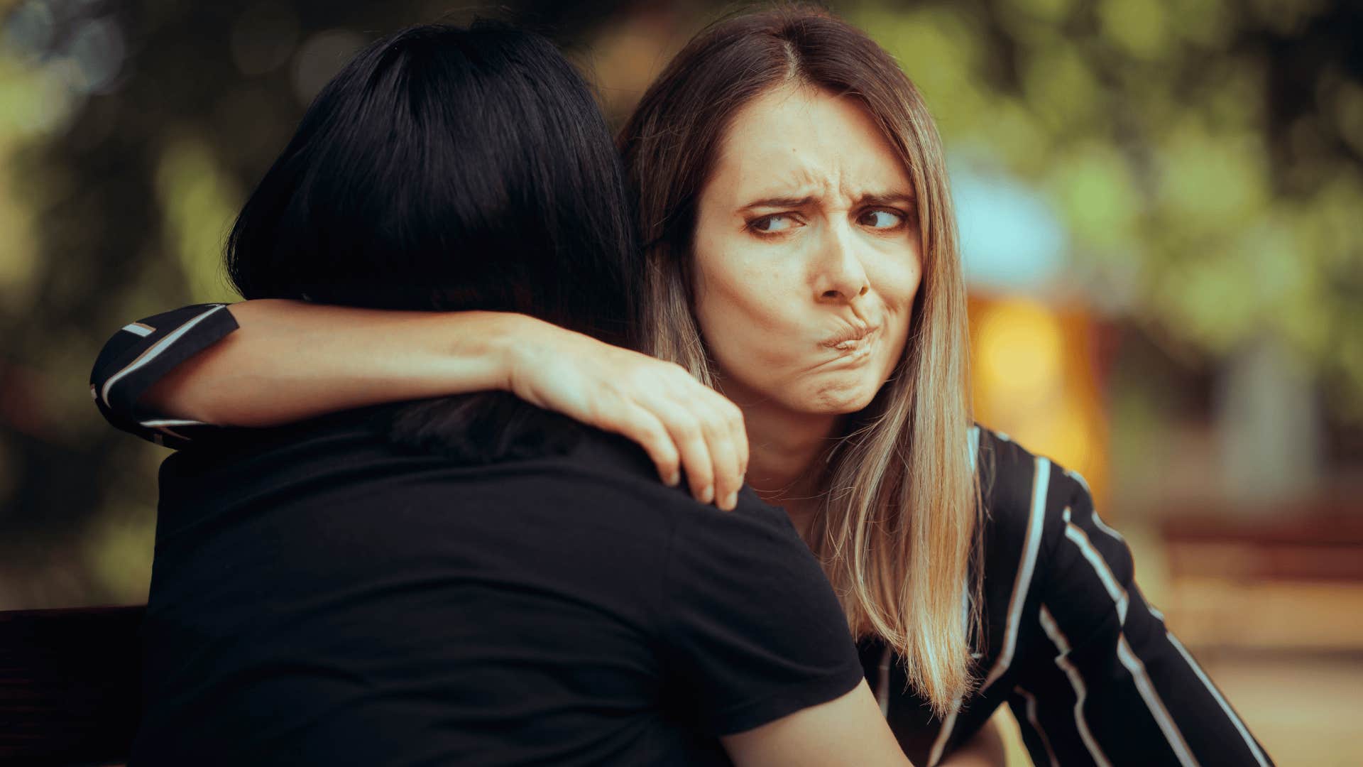 woman hugging friend feeling perceptive