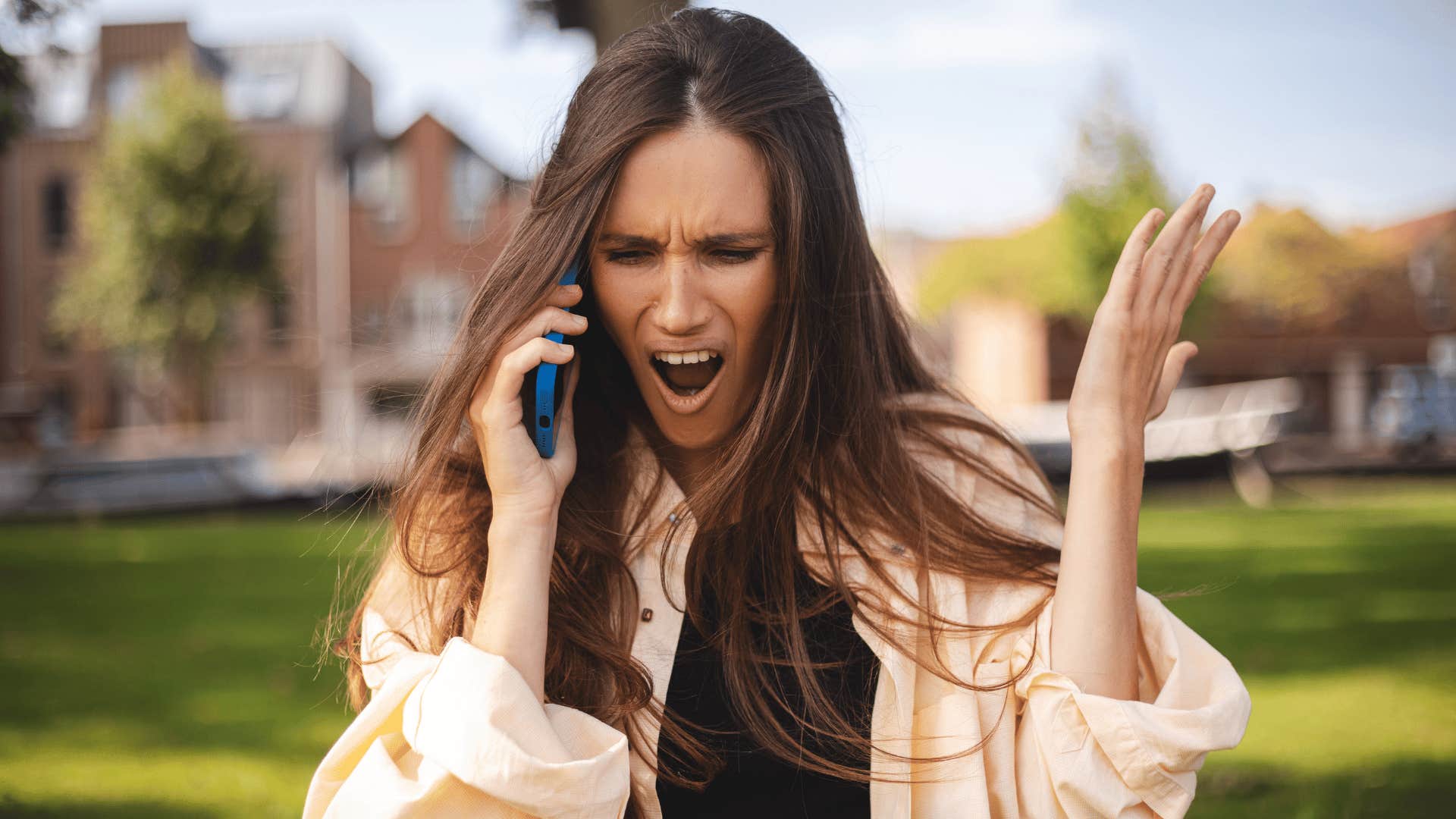 woman being emotionally and mentally exhausting on the phone saying fine forget it