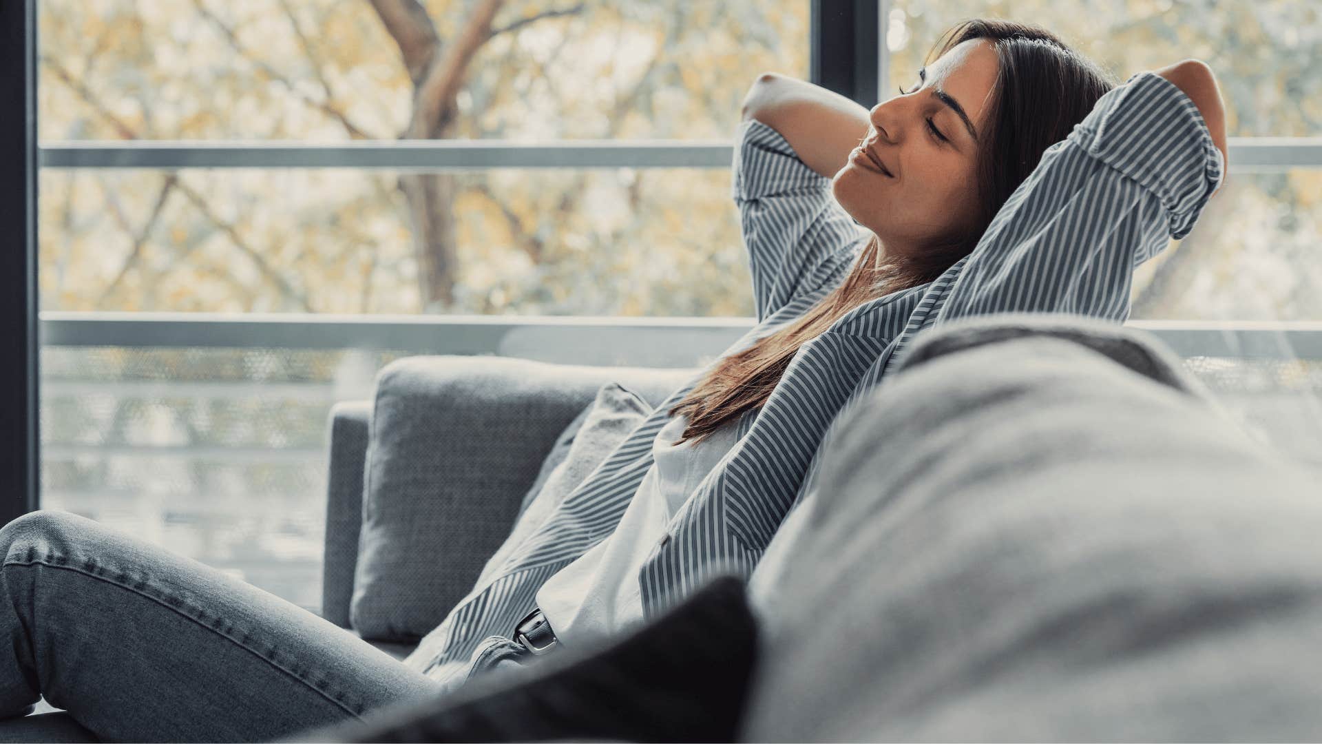 happy woman feeling comfortable being alone at home