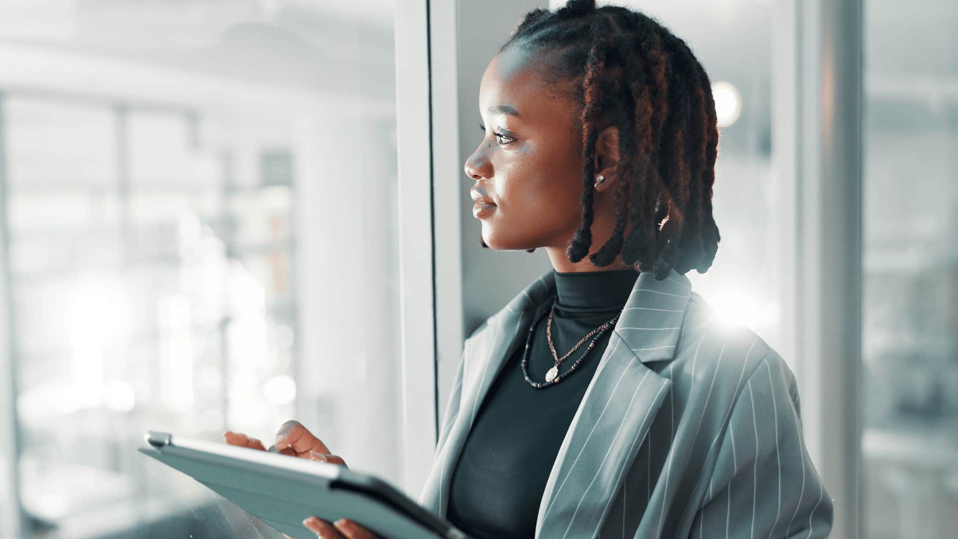 woman with strong observational awareness looking outside