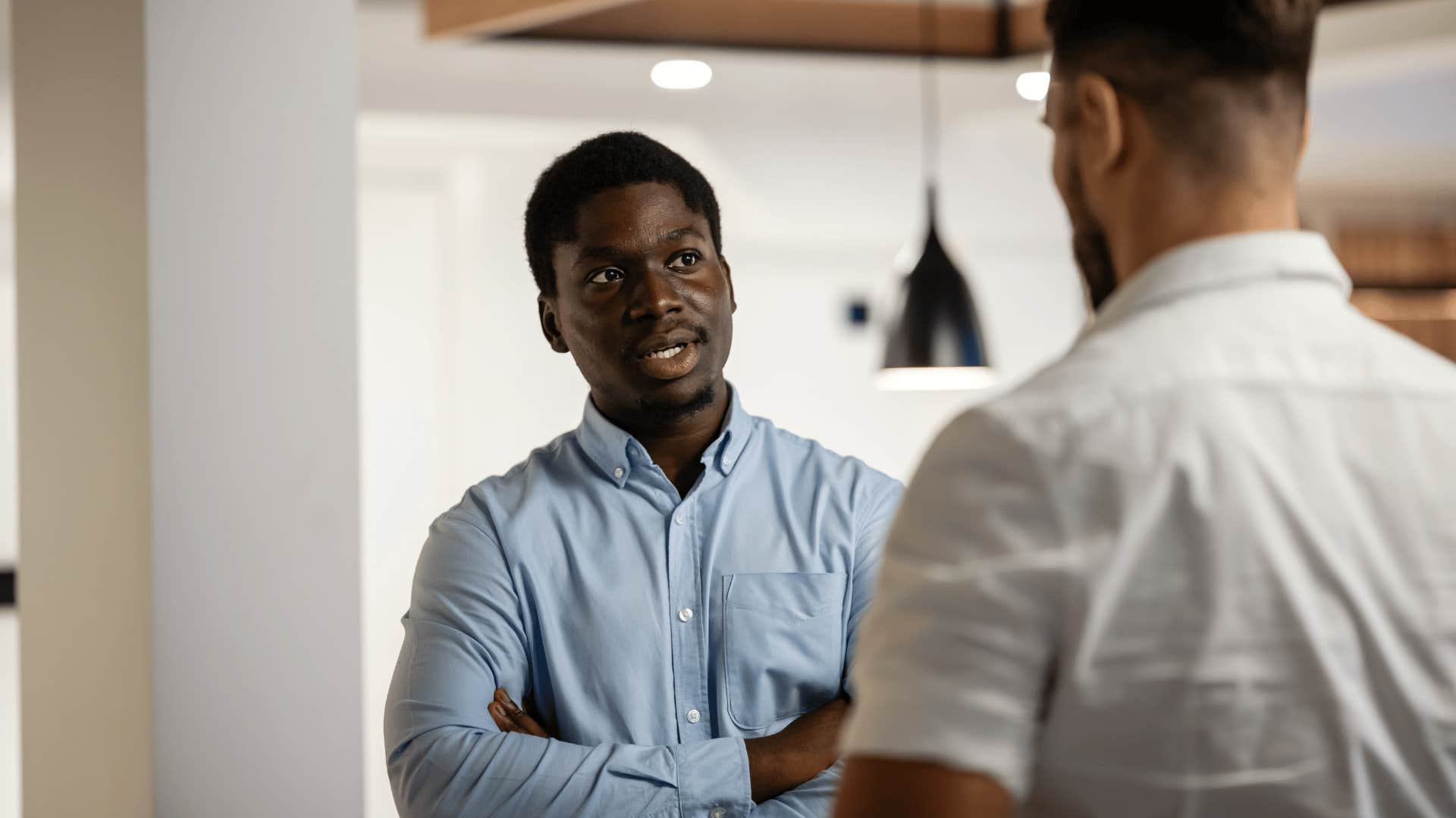 radically honest man having a conversation with colleague