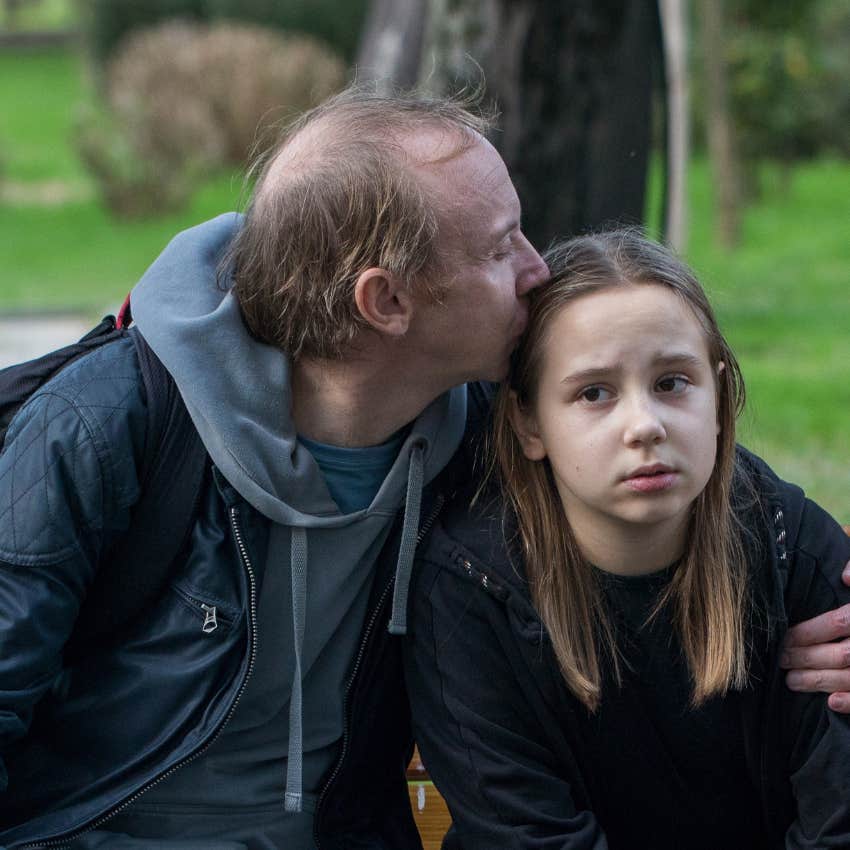 overprotective dad annoying his daughter kissing her head