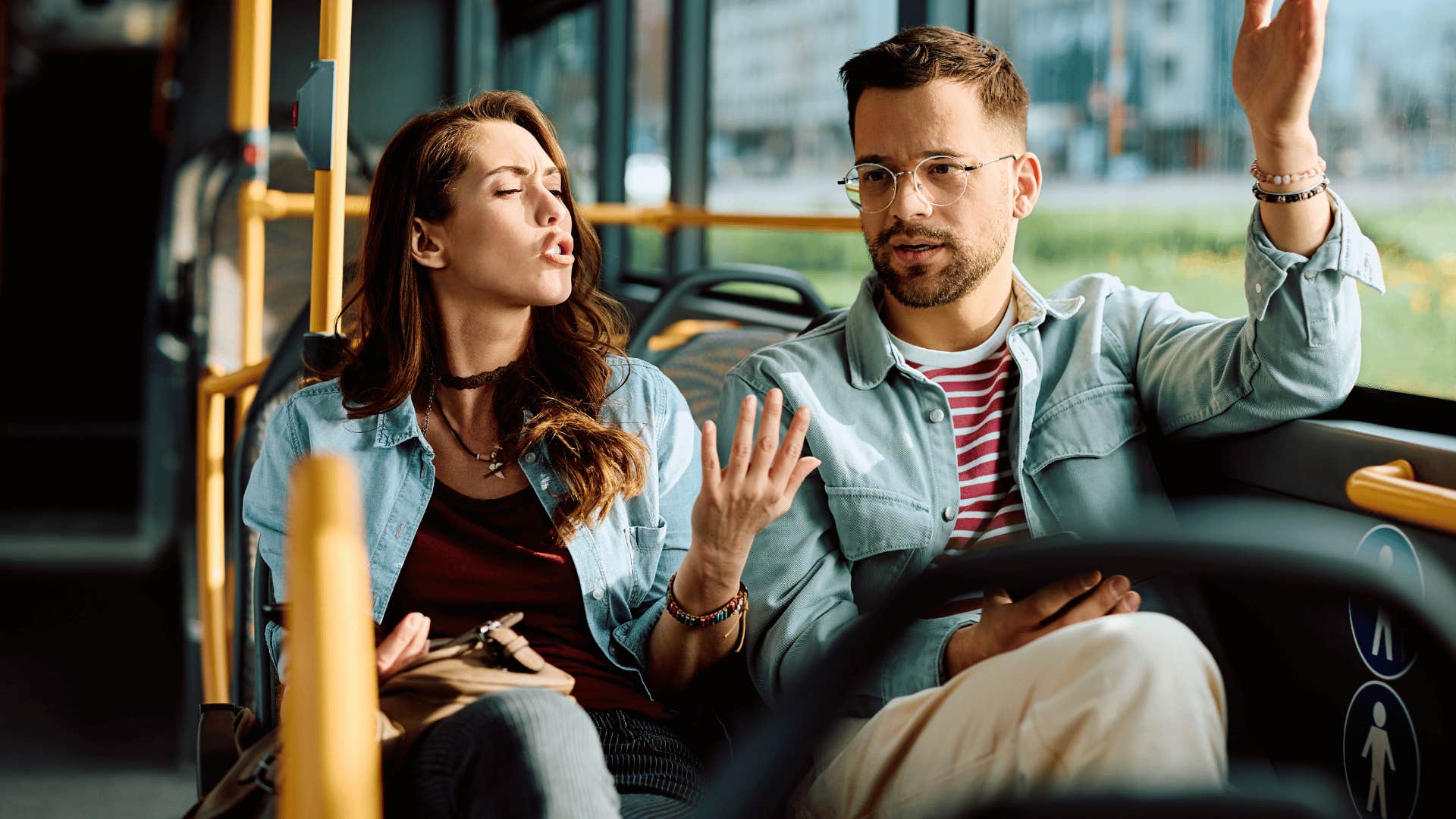 couple arguing on the bus as man says i don't owe anyone anything