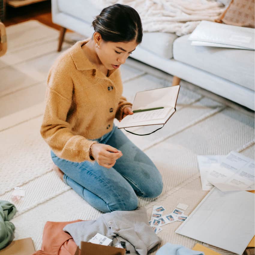 Thoughtful woman making a simple to-do list to calm her mind