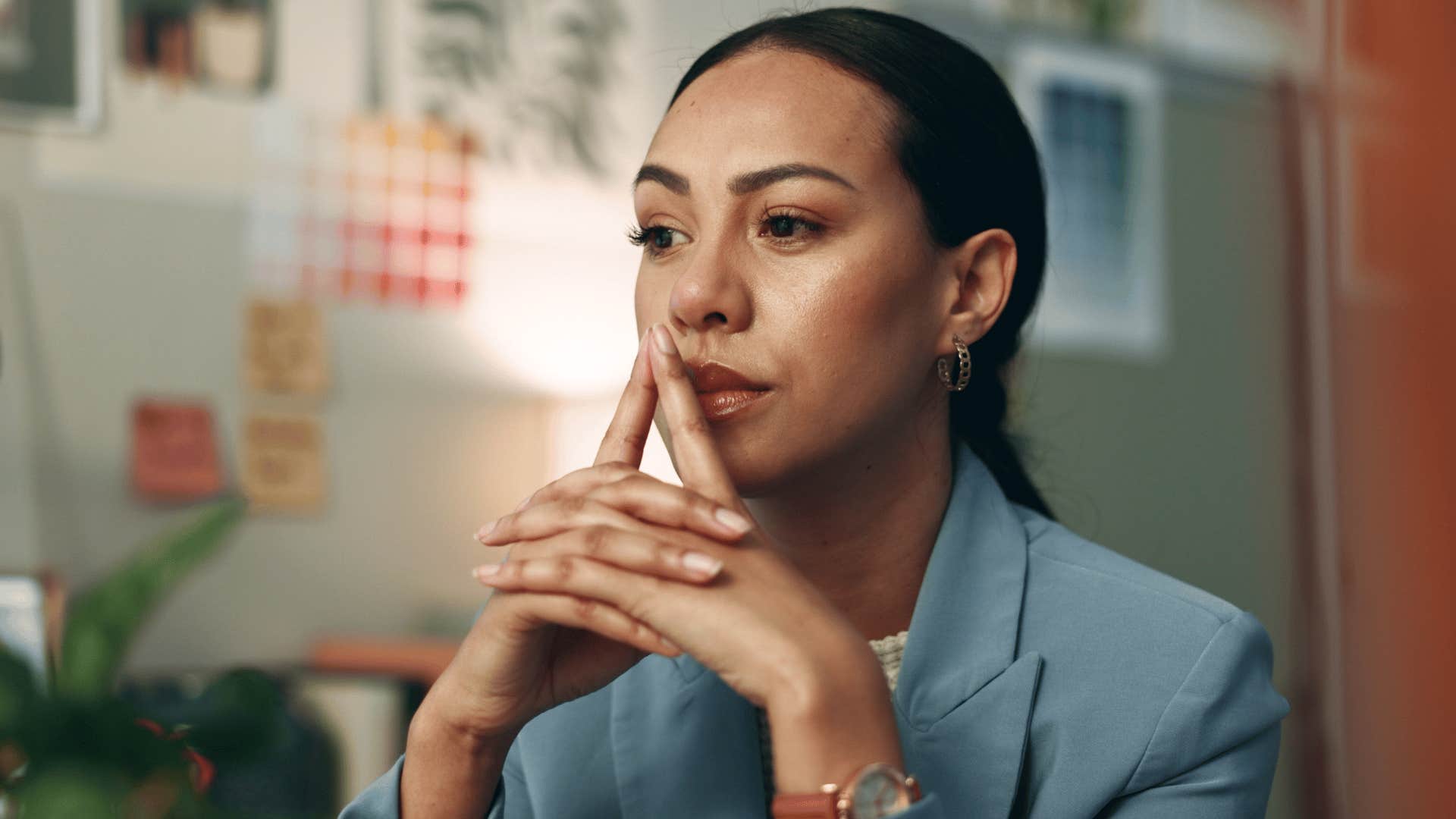 thoughtful woman deep in her imagination avoiding her phone