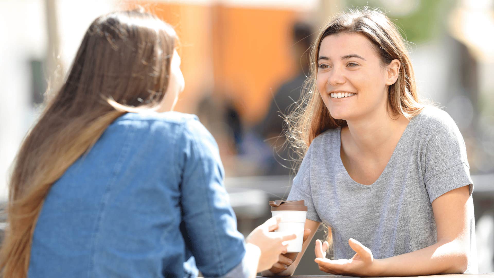 two friends talking over coffee protecting moments between them