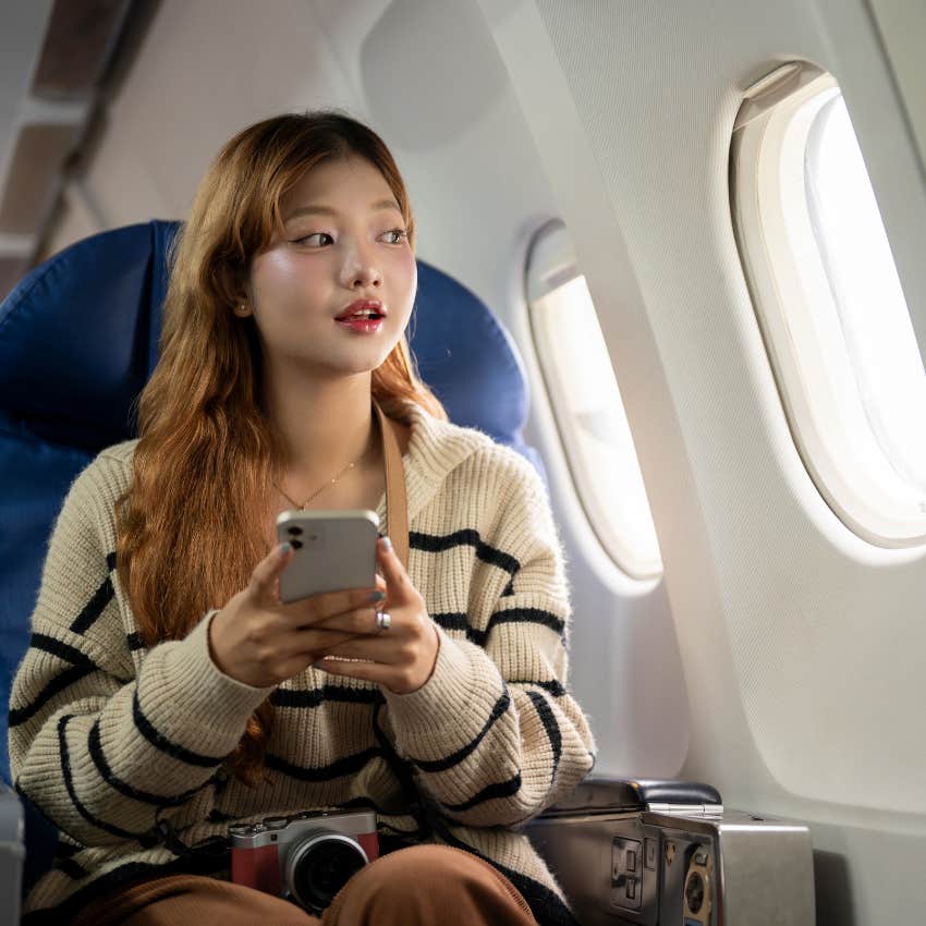 woman sitting on airplane