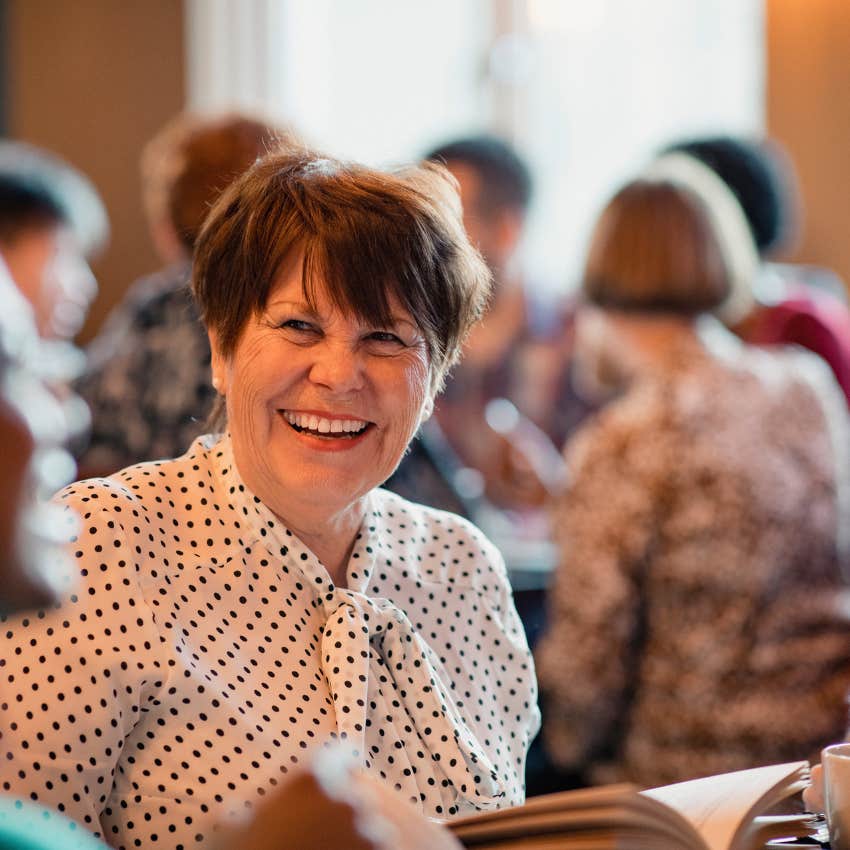woman focusing on her own happiness seeing friends