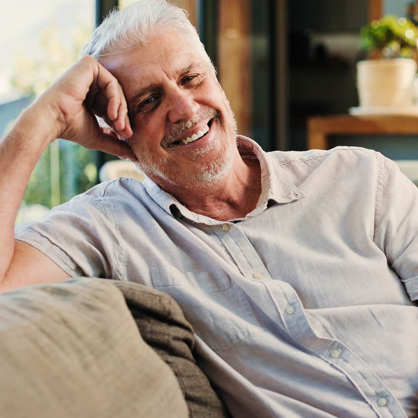 man who feels happy without social pressure smiling during rainstorm