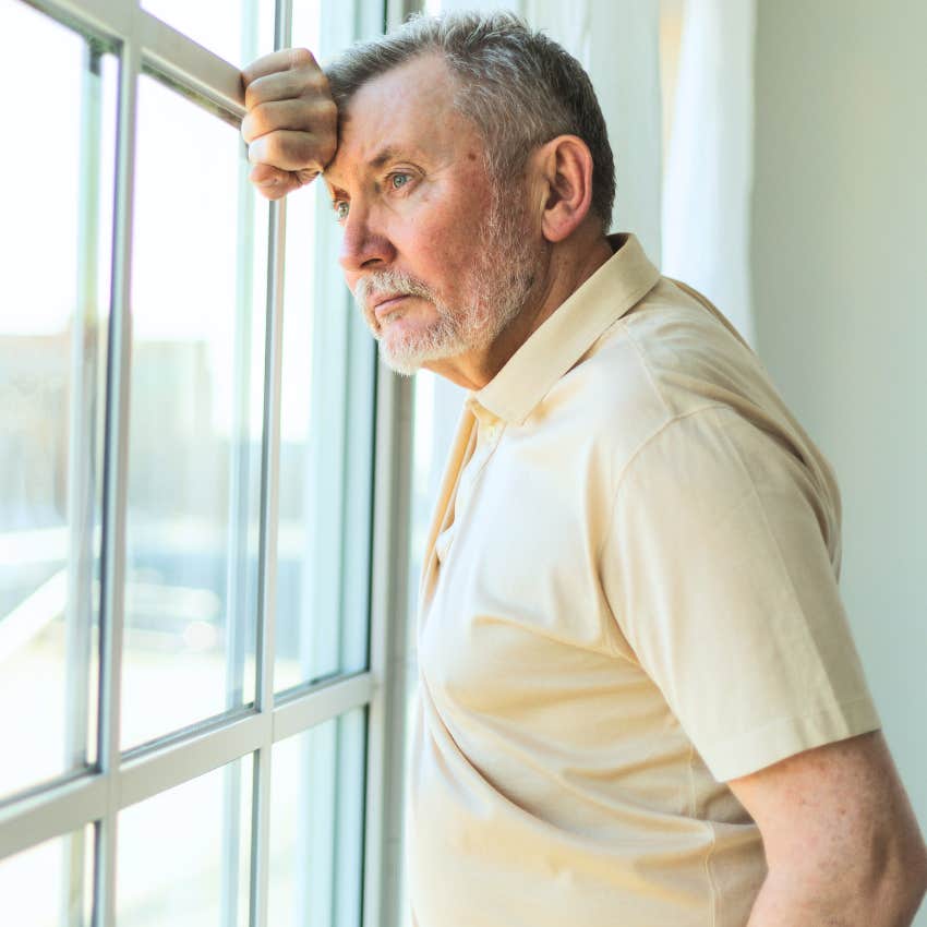Man feeling different and looking upset at home.