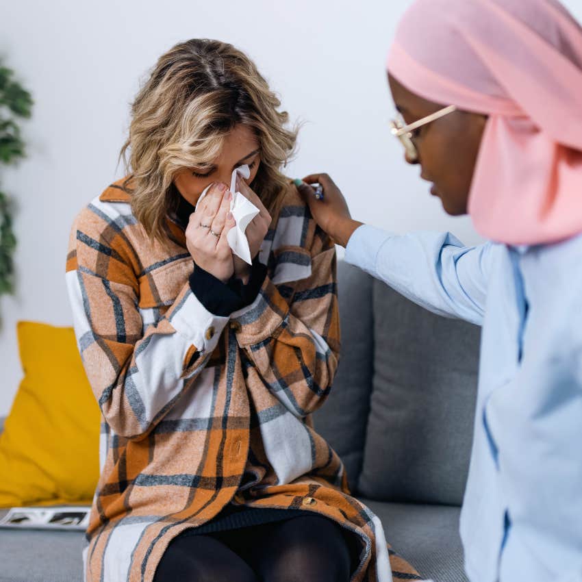 empathetic woman comforting friend