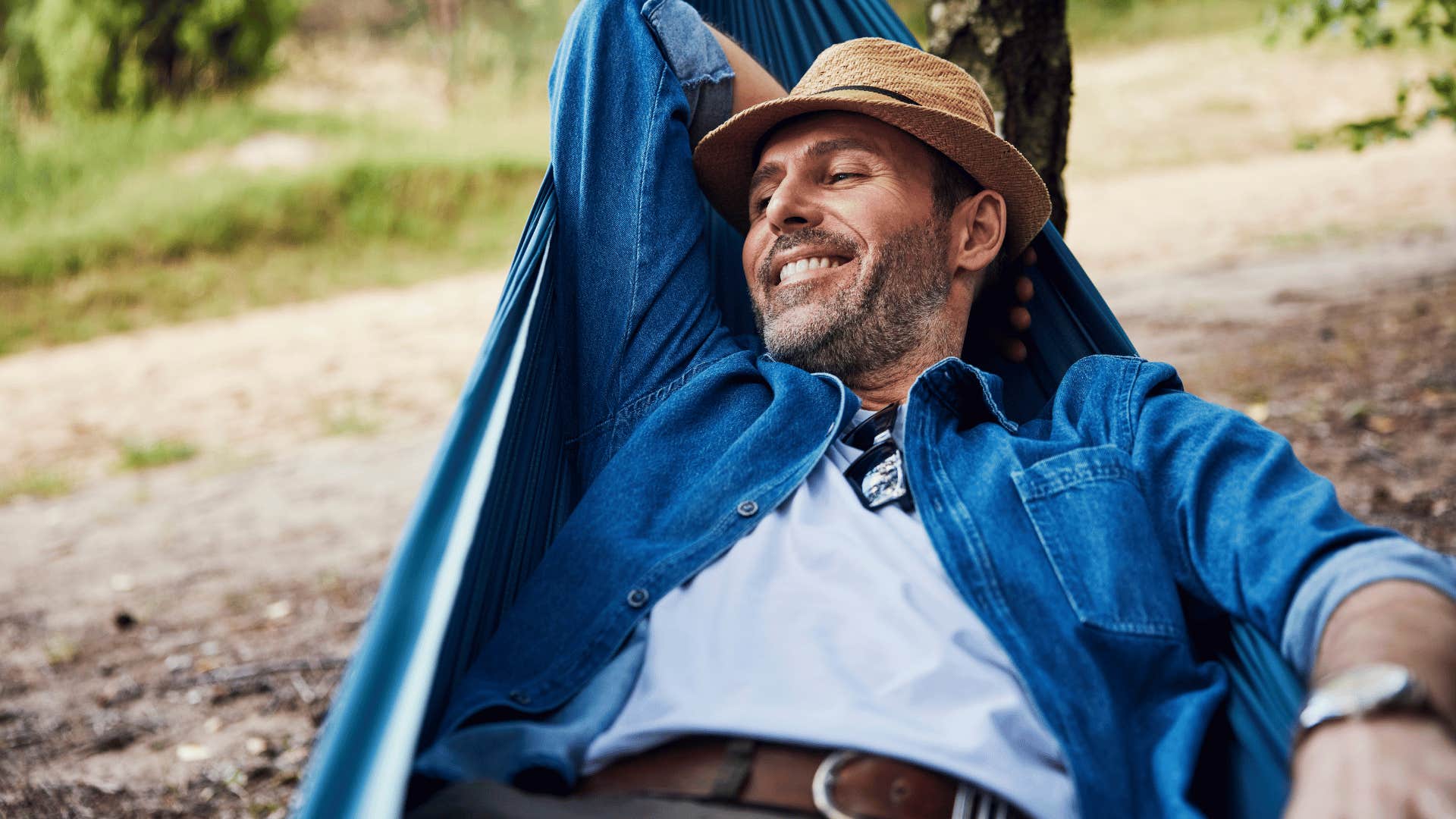 man choosing solitude alone outside in a hammock