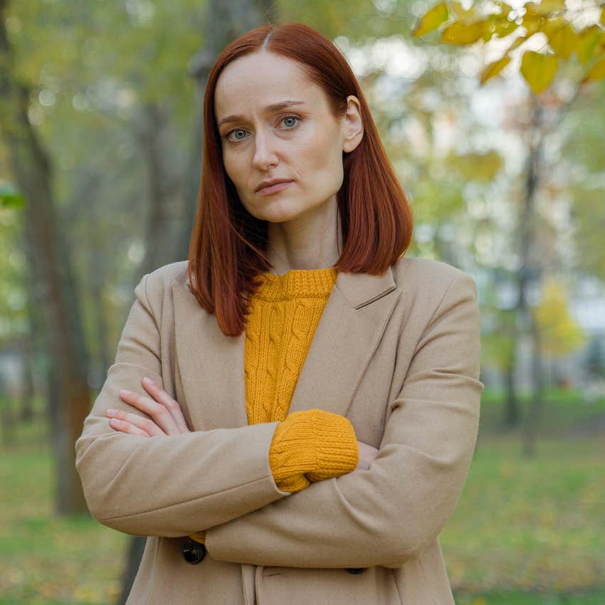 extremely independent woman feeling sad outdoors