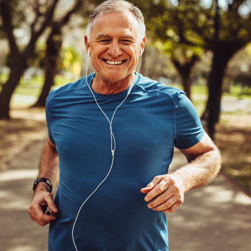man who needs time alone smiling while he exercises