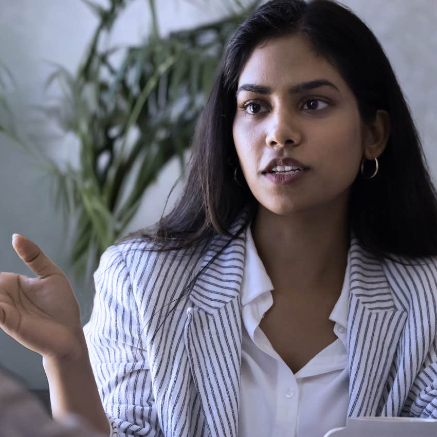 woman with overthinking tendencies telling colleague I keep coming back to this
