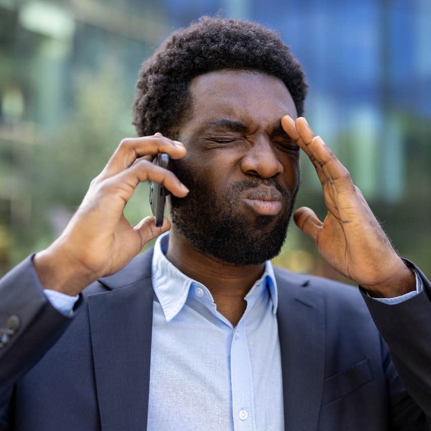frustrated man saying I might be overthinking this on the phone