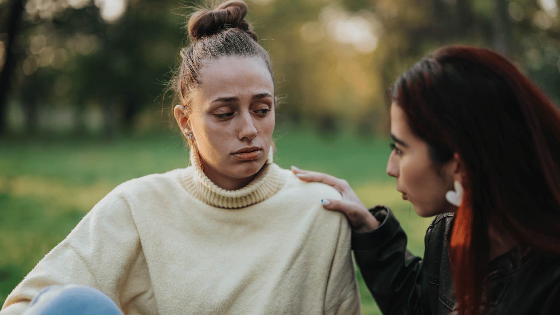 sad woman listening to annoying friend tell her to just be yourself