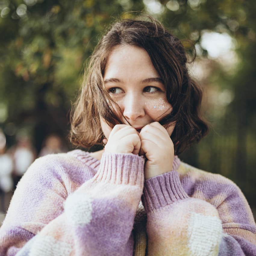 woman hiding her happiness