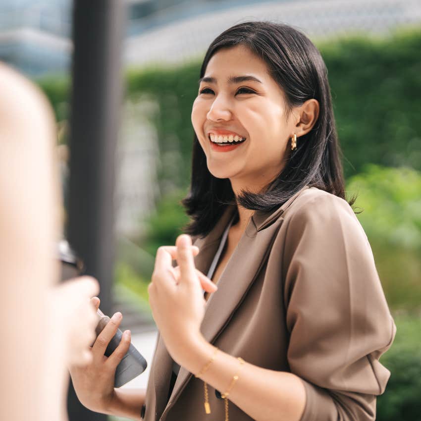 woman smiling saying she already made plans in conversation
