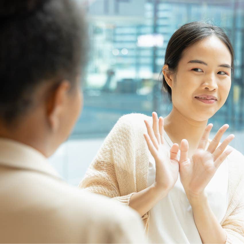 woman telling her friend she doesn't care what she thinks