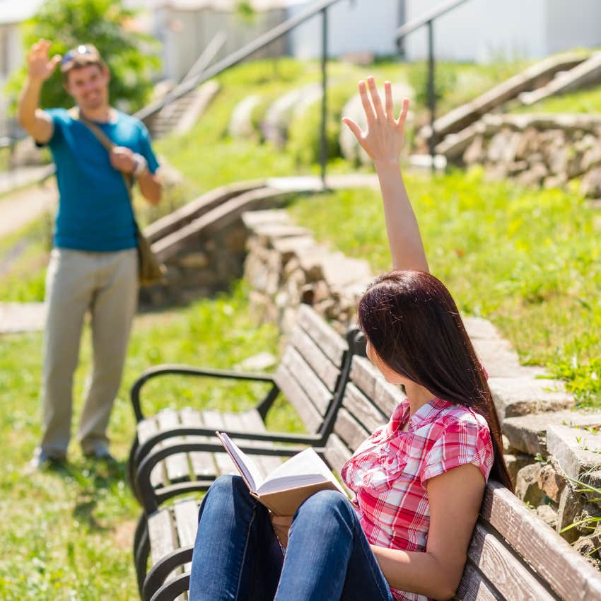 woman waving hi to a man
