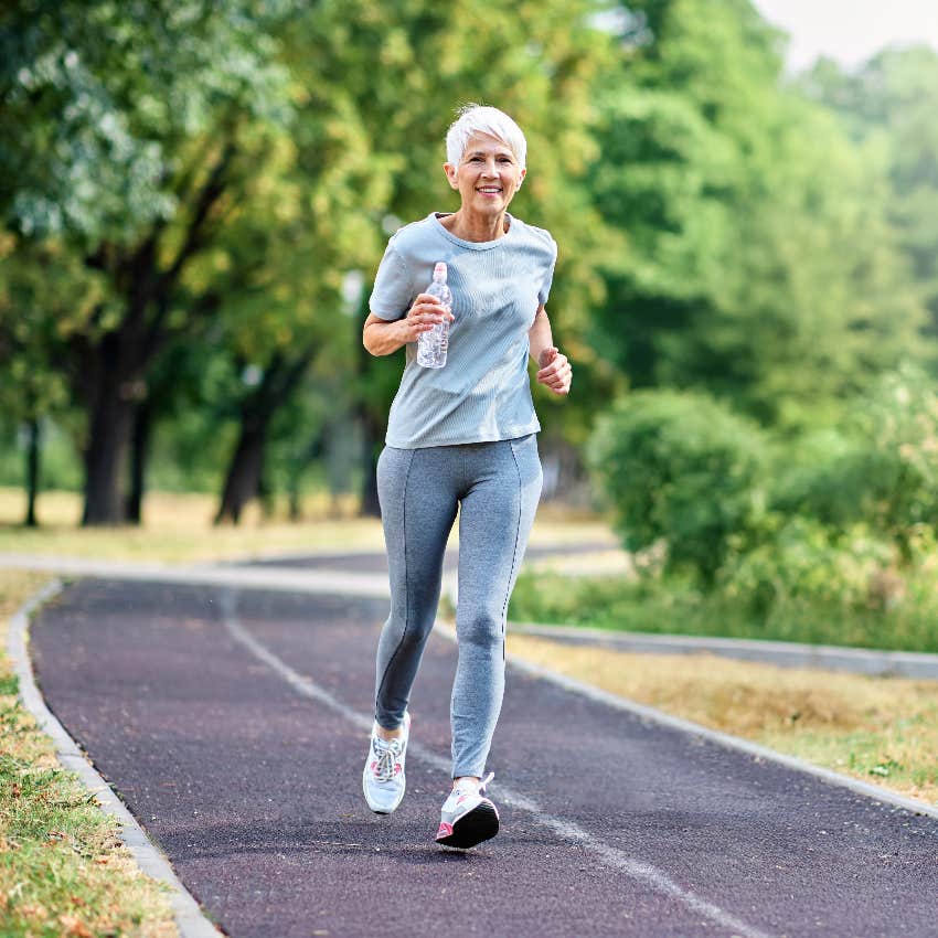 older woman running outside