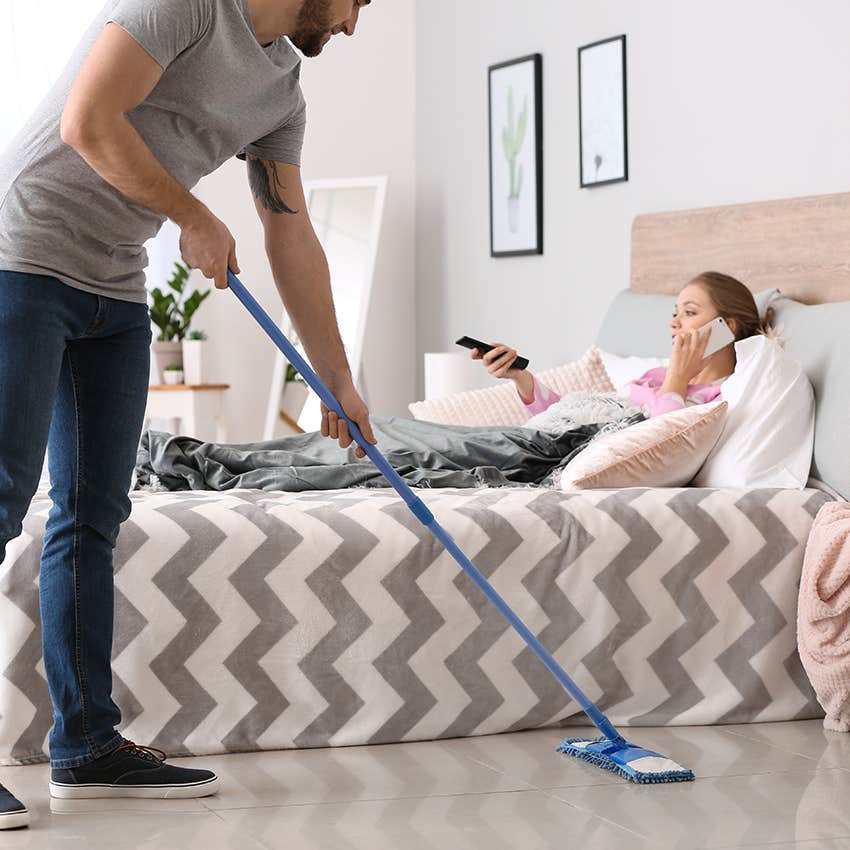 man doing chores for wife while she rests in bed