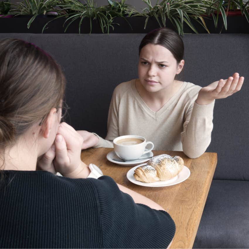confused woman asking intelligent friend are you insane
