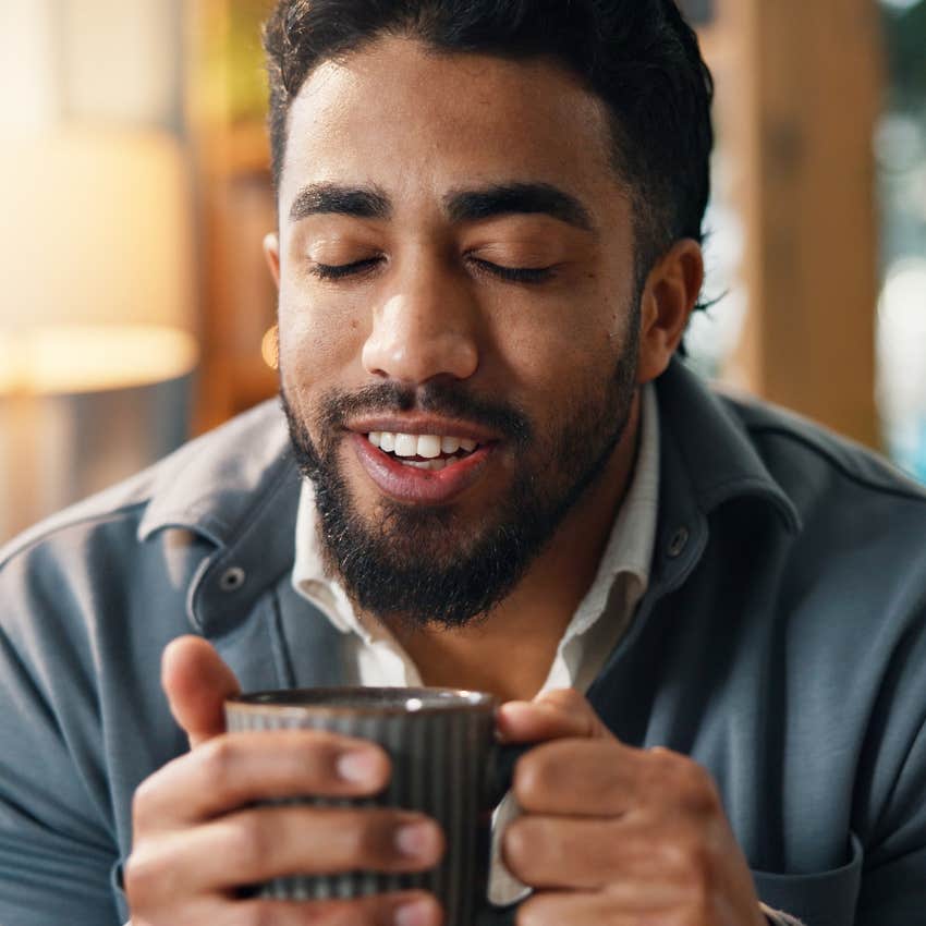 relaxed man drinking coffee to create stability for himself at home