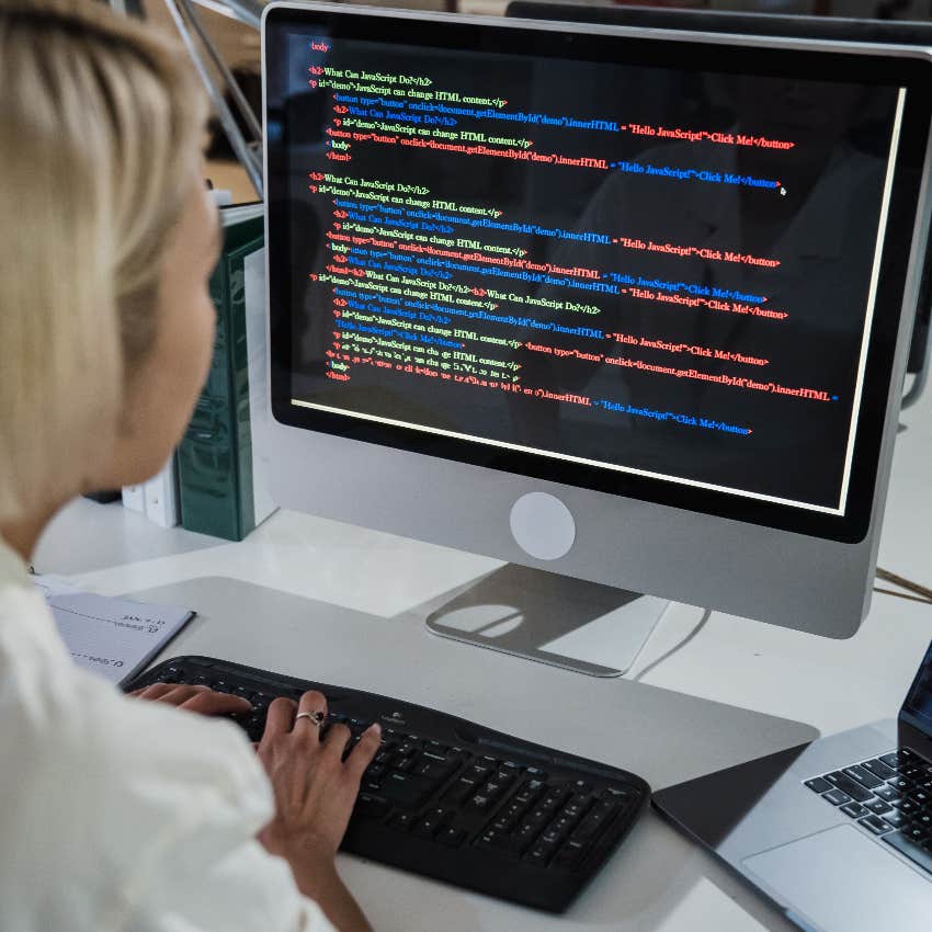 software engineer writing code at work