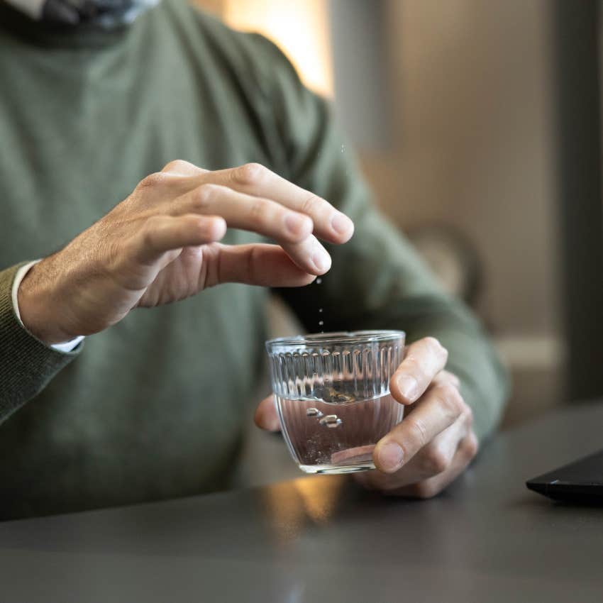 man putting pinch salt pepper water abundance