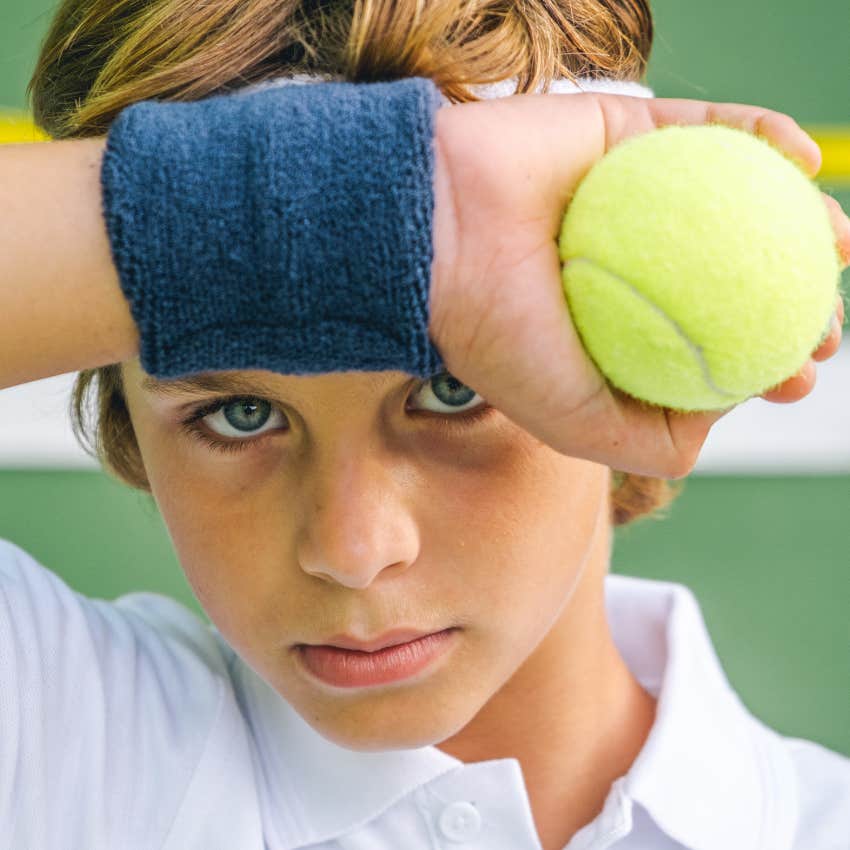 unhappy boy pressured into playing the sport of tennis