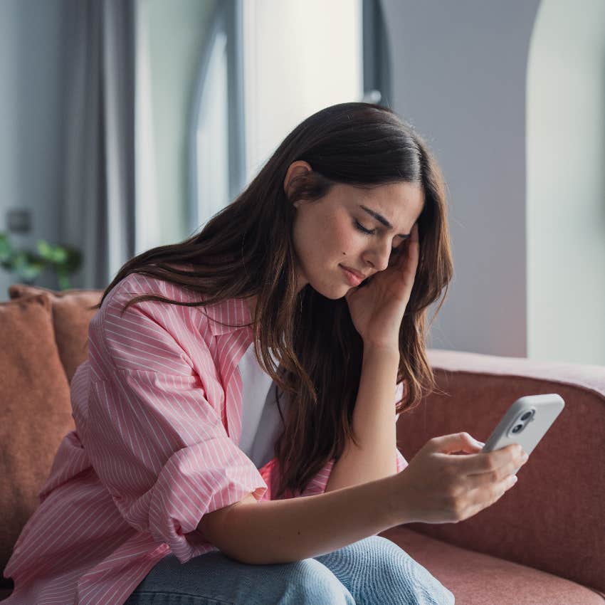 woman stressed about social life checking phone